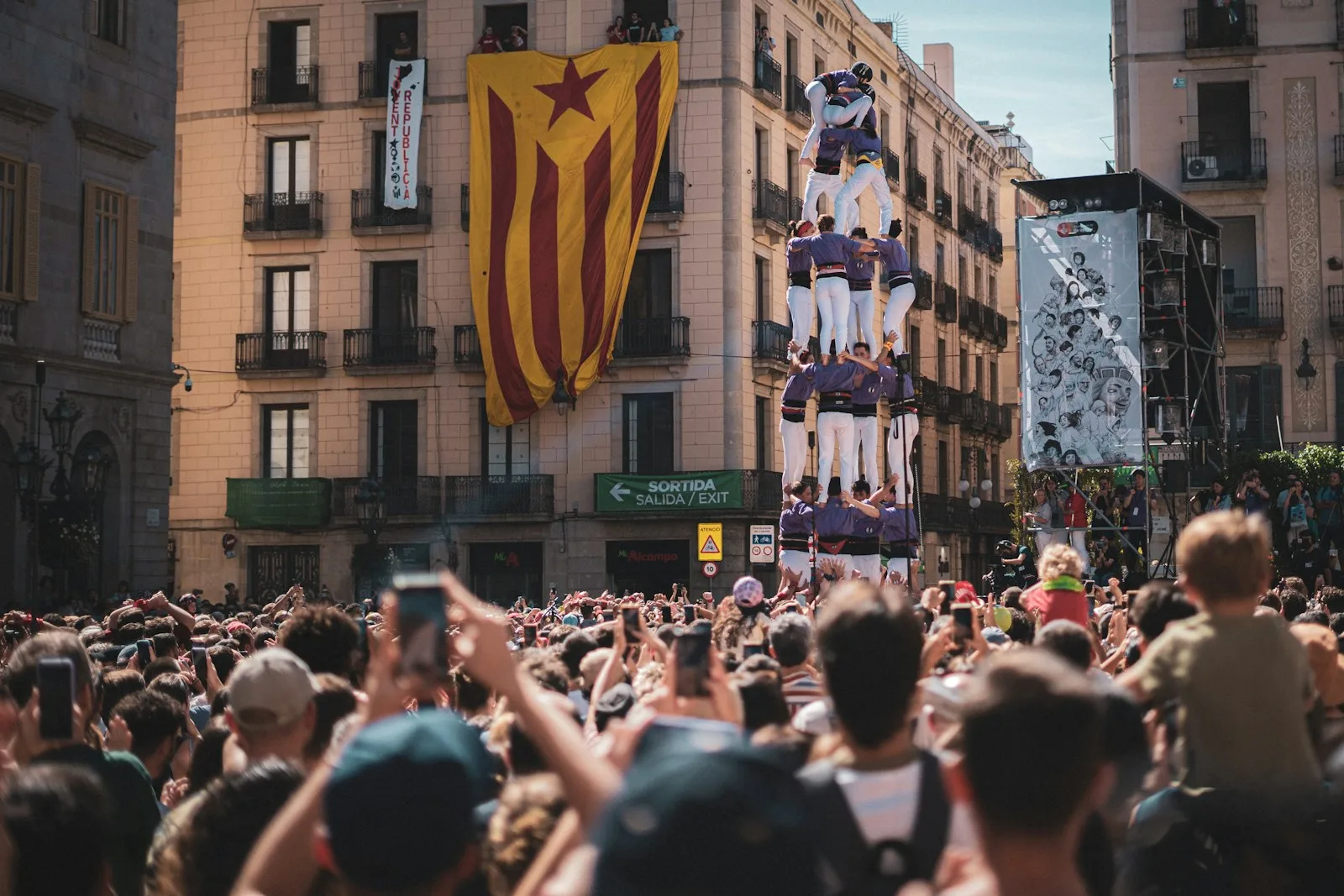 People watch a human tower performance.